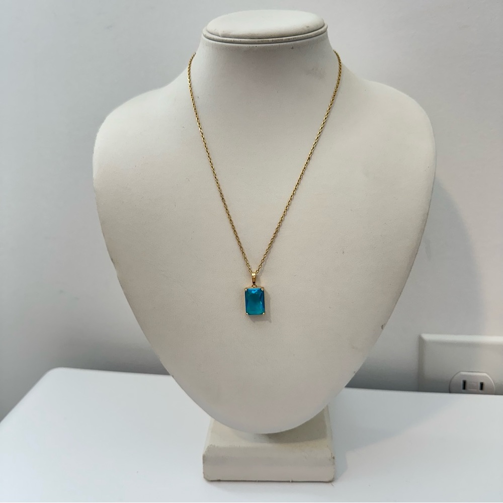 the giving keys blue emerald cut gemstone gold necklace